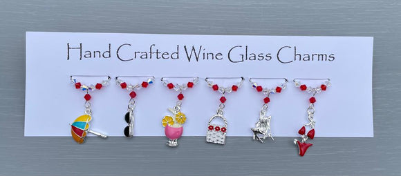 Beach themed Wine glass charms. Perfect gift for a beach lover or for yourself!     6 charms set on silver plated rings, with Austrian crystals.  Item will be sent in an organza bag.     Crystal colours can be changed – see next picture.   Please contact me if you require different coloured crystals.