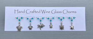 Turtle themed Wine glass charms. Perfect gift for someone who loves the ocean or for yourself.   6 charms set on silver plated rings, with crystals.  Item will be sent in an organza bag.  Crystal colours can be changed – see next picture.   Please contact me if you require different coloured crystals.  **15% of total cost donated to WWF**