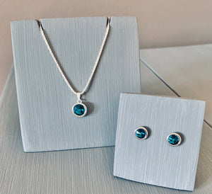 Set on a 925 Sterling Silver Chain is an Pendant necklace set with a Blue Zircon Swarovski Crystal  Earrings sold separately or in a set   This makes a stunning gift for Christmas, birthdays and anniversary  Blue Zircon is the December Birthstone colour and crystals are the anniversary gift for 15 years  Gift boxed this gorgeous necklace is also a perfect Mother's day Gift  Please take time to browse my shop for other Bridal Jewellery, accessories and Gift Ideas