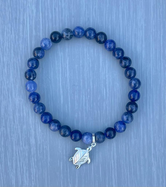 Sterling silver Turtle charm with Sodalite Gemstone beads on an elasticated bracelet.   **15% of total cost is donated to WWF**