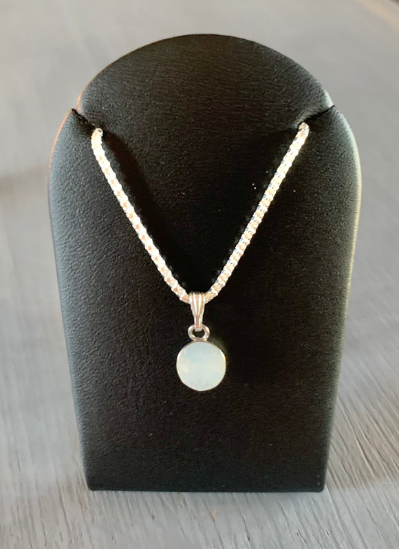 Set on a 925 Sterling Silver Chain is a solitaire style necklace set with a White Opal Specialist Crystal.